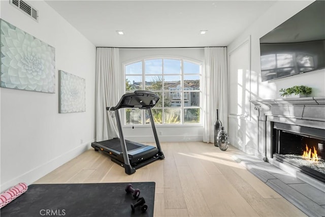 workout area featuring hardwood / wood-style floors