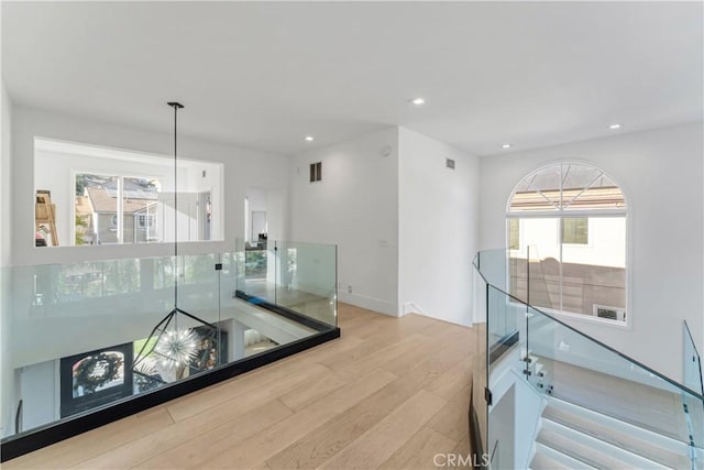 interior space featuring a wealth of natural light and light hardwood / wood-style floors