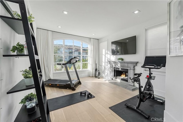 exercise room with hardwood / wood-style floors