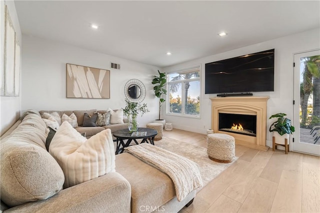 living room with light hardwood / wood-style floors