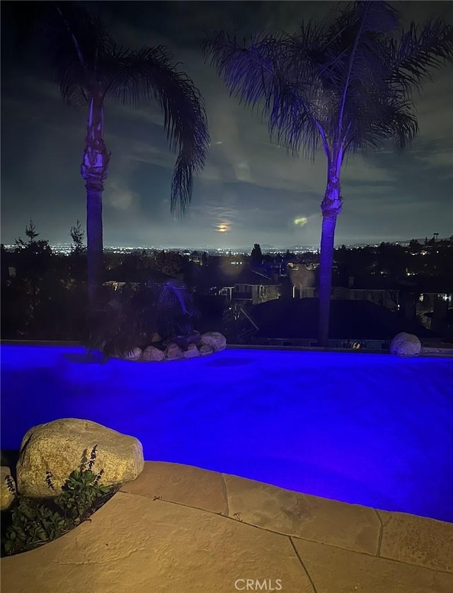 view of pool at night