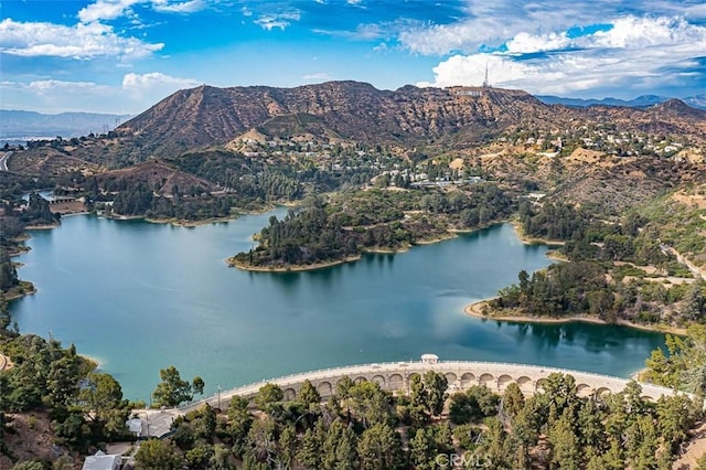 drone / aerial view with a water and mountain view