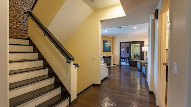 stairs featuring hardwood / wood-style floors