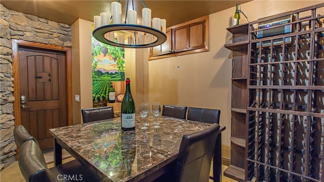 wine area with an inviting chandelier