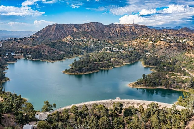 bird's eye view with a water and mountain view