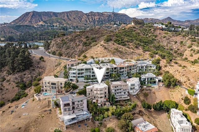 birds eye view of property featuring a mountain view