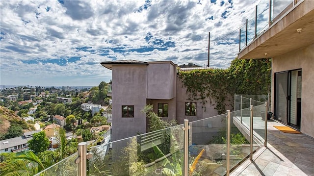 view of property exterior featuring a balcony