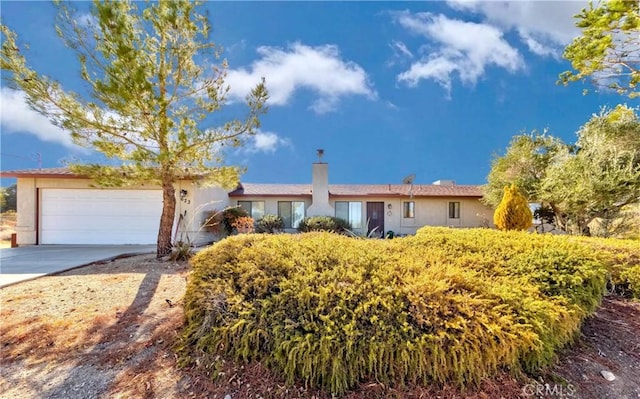 ranch-style house featuring a garage