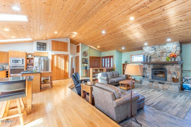 living room with a stone fireplace, wooden ceiling, vaulted ceiling, and light wood-type flooring