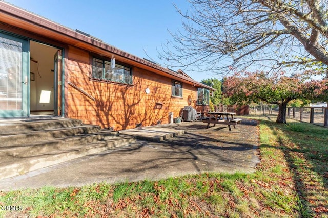 view of home's exterior with a patio