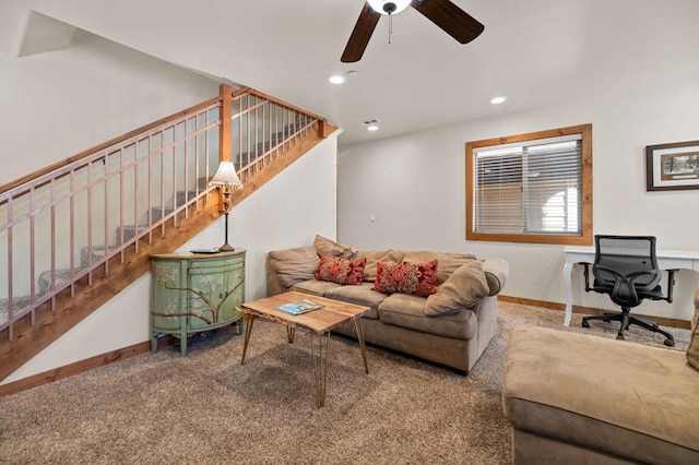 carpeted living room featuring ceiling fan