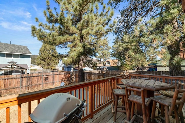 wooden deck featuring grilling area