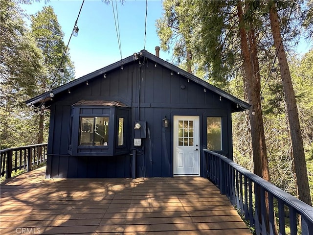 back of house featuring a deck