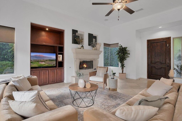 tiled living room featuring crown molding and a healthy amount of sunlight