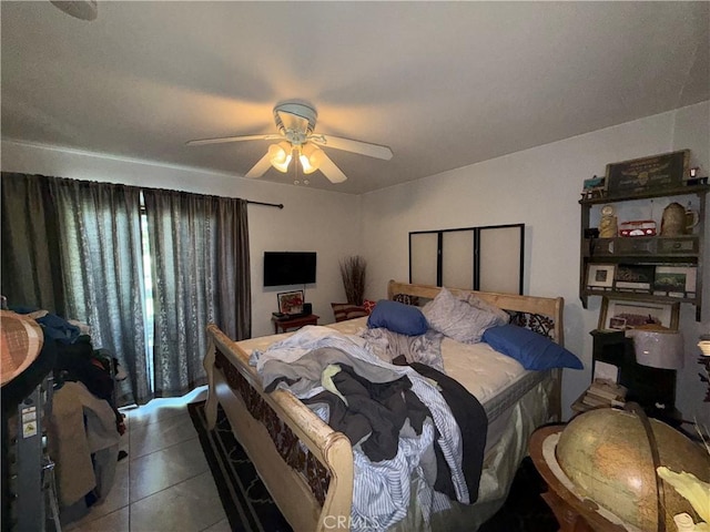 bedroom with light tile patterned floors and ceiling fan