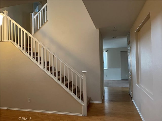 stairway featuring hardwood / wood-style flooring