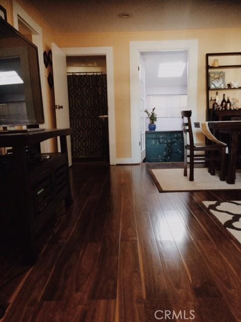 hall with dark hardwood / wood-style flooring