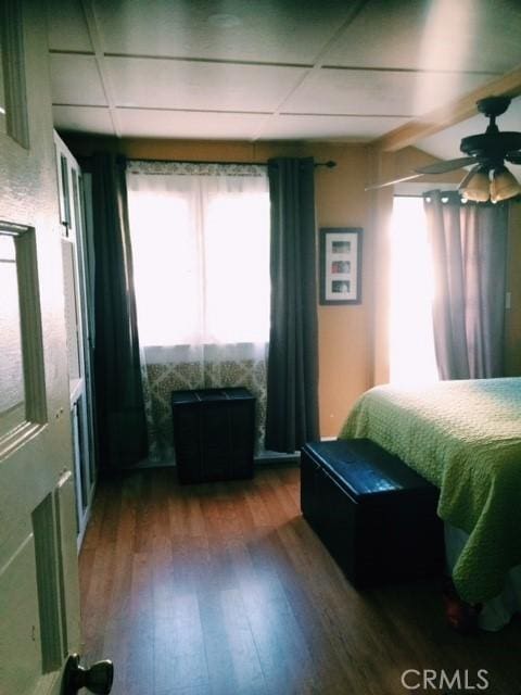 bedroom with ceiling fan and wood-type flooring