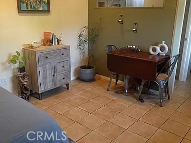 miscellaneous room with light tile patterned floors