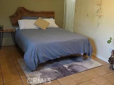 bedroom featuring tile patterned floors