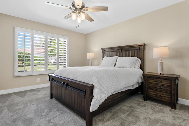 bedroom featuring ceiling fan and light colored carpet