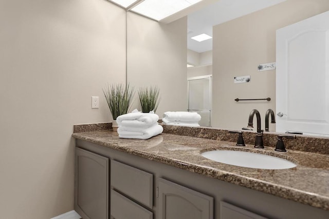 bathroom with vanity and an enclosed shower