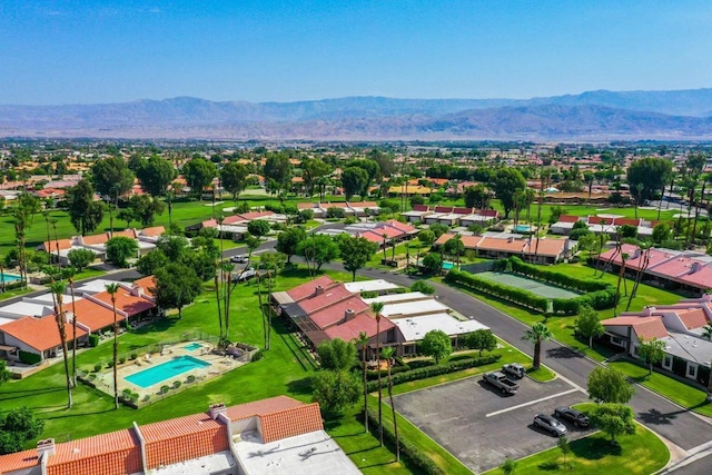 birds eye view of property with a mountain view