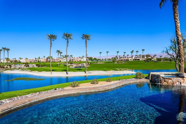 view of swimming pool with a water view