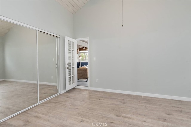 unfurnished bedroom with a closet and light hardwood / wood-style flooring