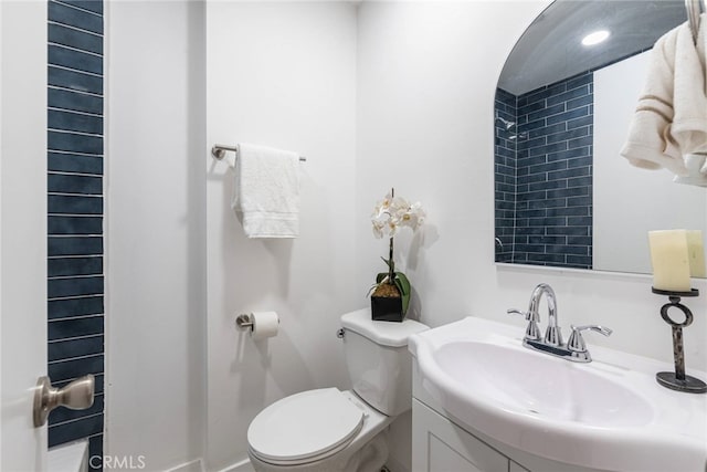 bathroom with toilet and vanity