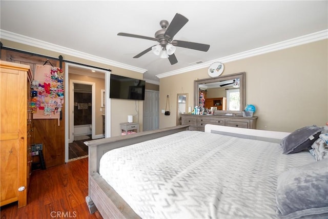 bedroom with ceiling fan, a barn door, ornamental molding, and dark wood-type flooring