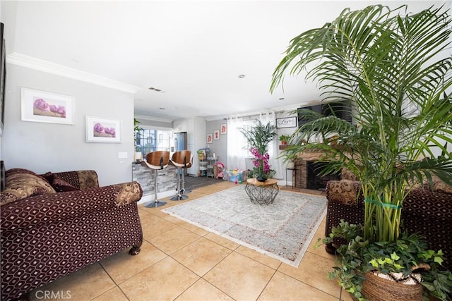 living room with light tile patterned floors and ornamental molding