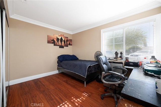 bedroom with crown molding and wood-type flooring