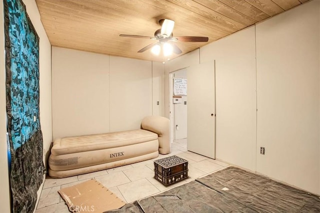 unfurnished room with light tile patterned floors, ceiling fan, and wood ceiling