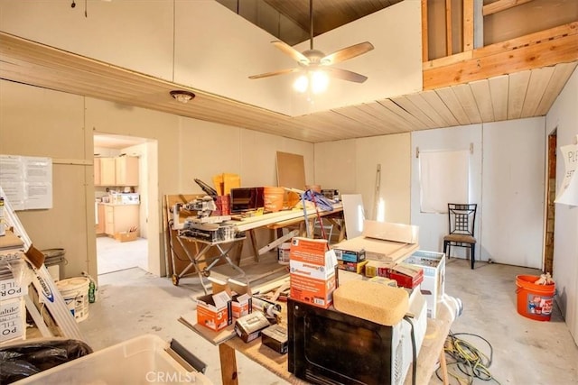 interior space featuring ceiling fan and wooden ceiling