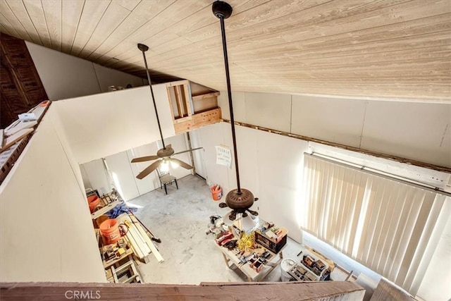 interior space featuring wooden ceiling, ceiling fan, and concrete floors