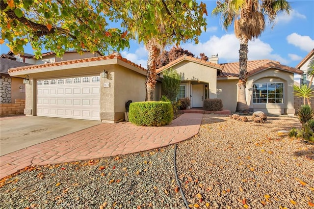 mediterranean / spanish-style home featuring a garage