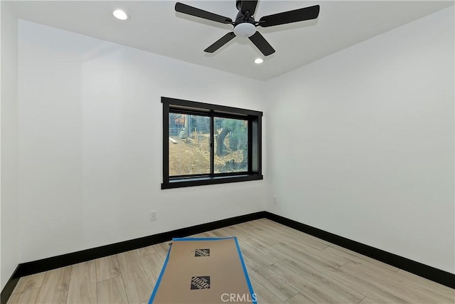 unfurnished room featuring ceiling fan and light hardwood / wood-style flooring