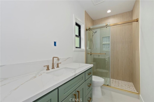 bathroom with a shower with shower door, toilet, and vanity