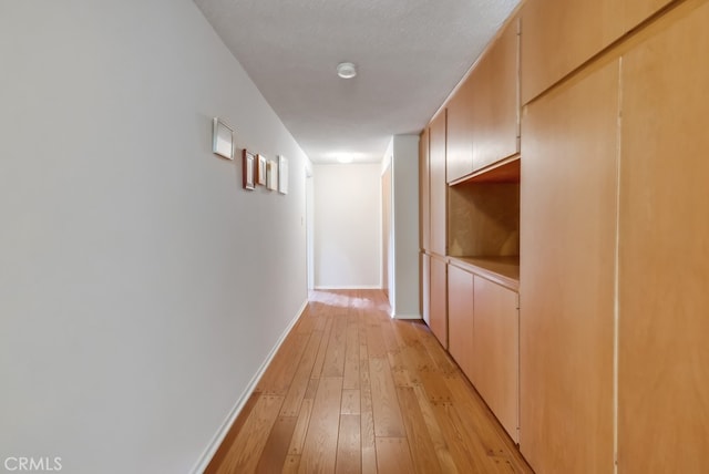 hall with light wood-type flooring