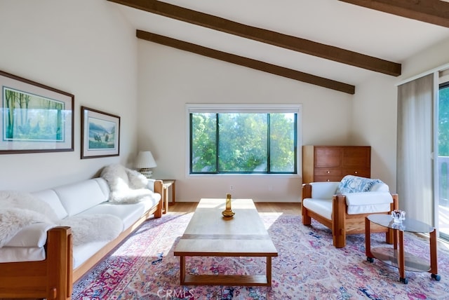 living room with beamed ceiling, high vaulted ceiling, and light wood-type flooring