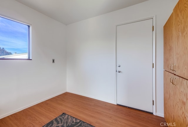 unfurnished room with light hardwood / wood-style flooring