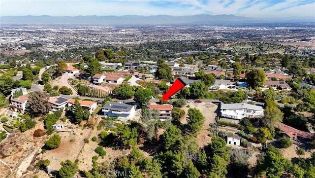 drone / aerial view featuring a mountain view