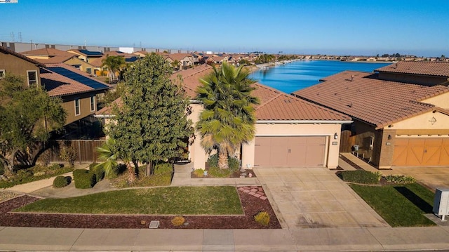 birds eye view of property with a water view