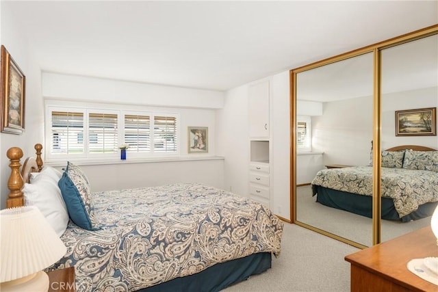 carpeted bedroom featuring a closet