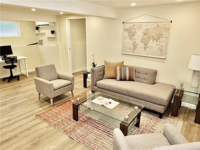 living room featuring recessed lighting, baseboards, and wood finished floors