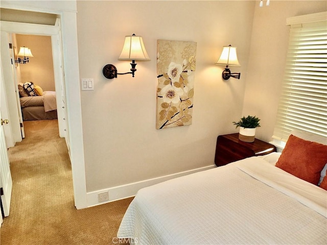 bedroom with carpet and baseboards