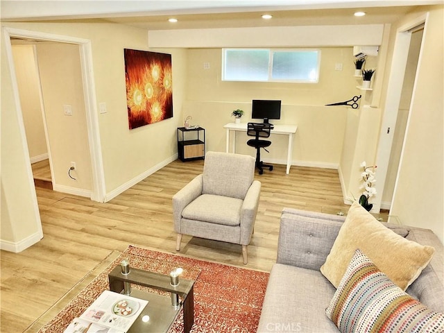 living room with recessed lighting, wood finished floors, and baseboards