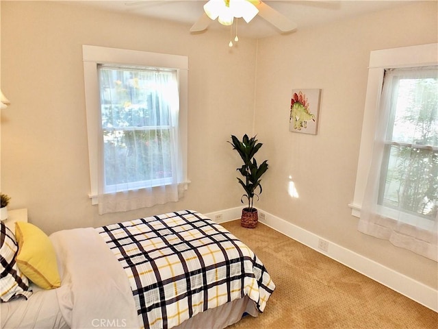 bedroom featuring carpet, ceiling fan, and baseboards