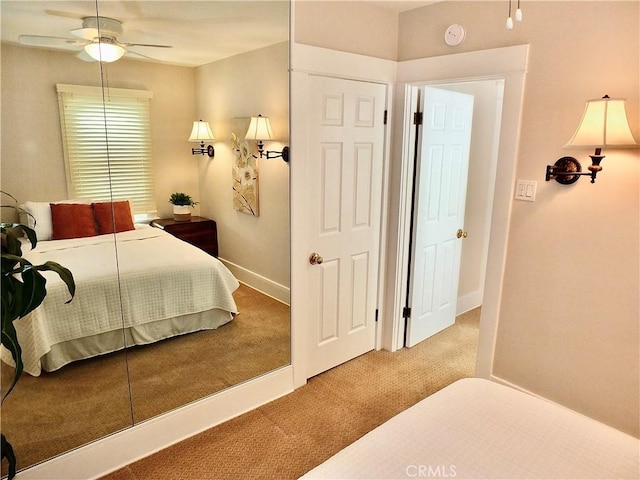 carpeted bedroom with baseboards